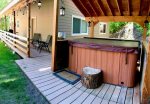 Easy access to the covered  hot tub with an ambiance in any weather.